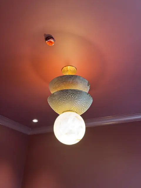 Stacked pendant in a pink room