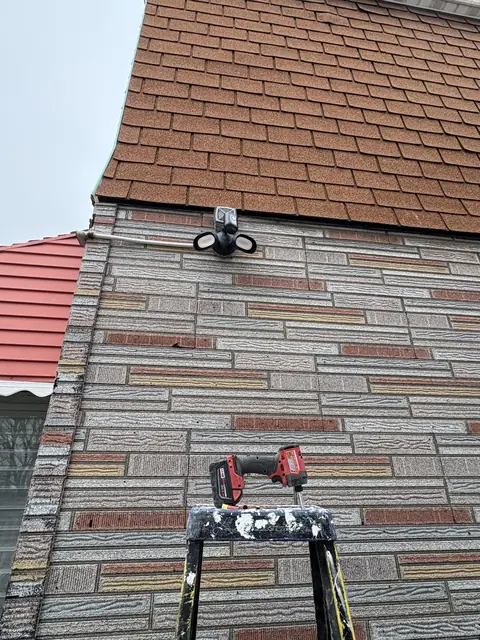 Installing a floodlight on a brick facade