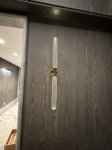 Glass rod wall sconce