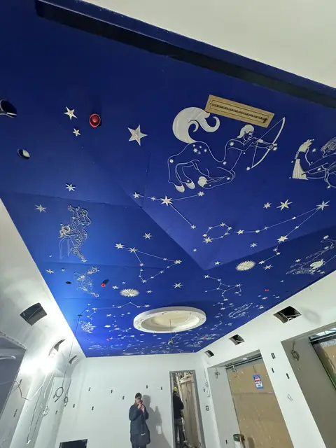 Painted zodiac ceiling with new lighting